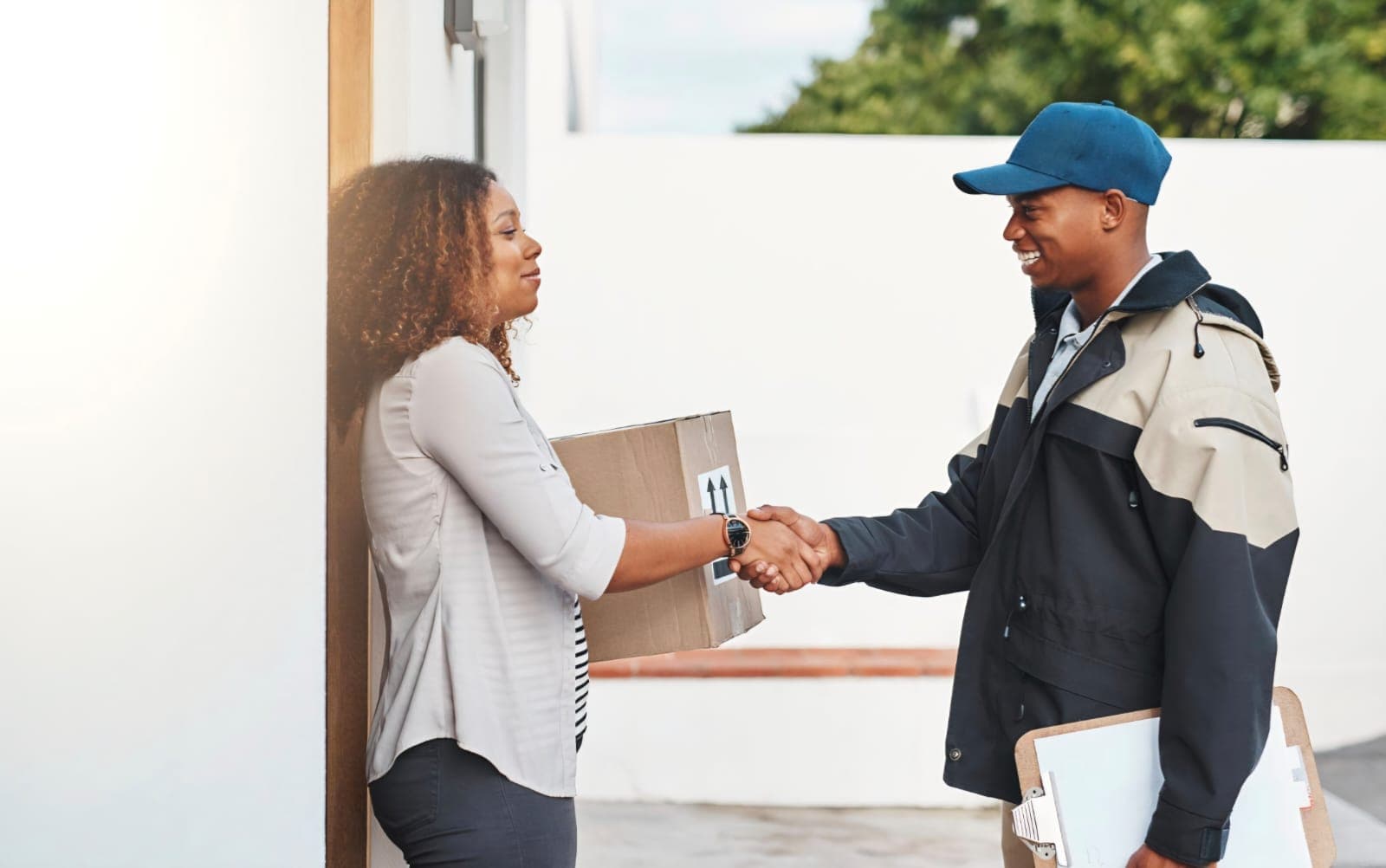 Mercury Services driver delivering a parcel to a happy customer