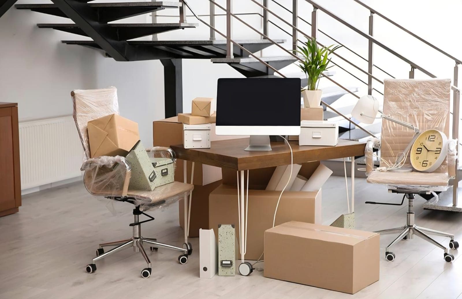 Professionally wrapped office furniture ready to relocate